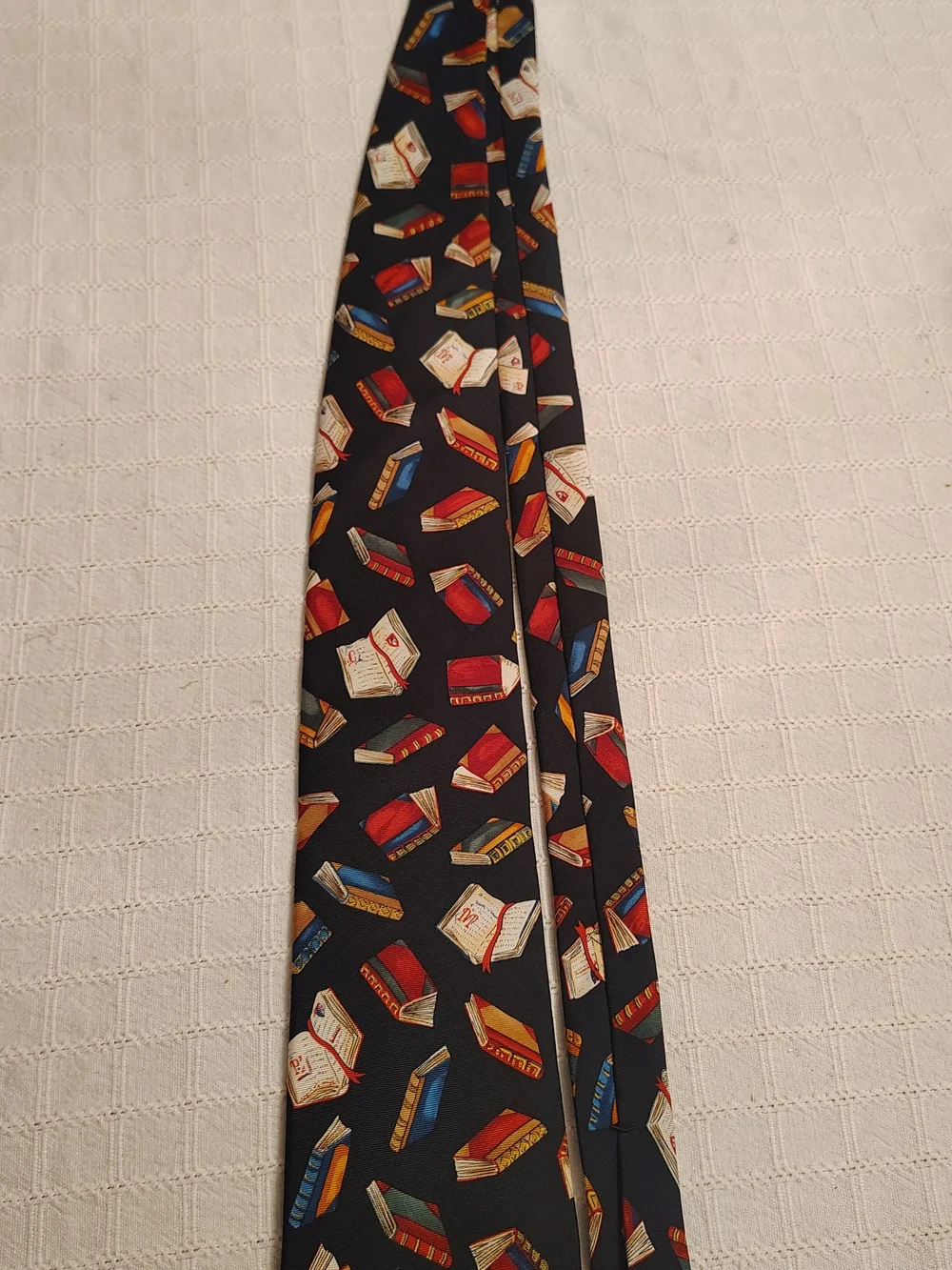 Novelty Book Print Silk Tie in Black with Red, Blue and Gold Books
